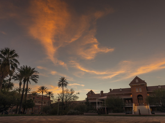 Old Main building at University of Arizona with clouds and sunset