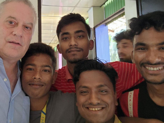 Bill Simmons with four men from Bangladesh