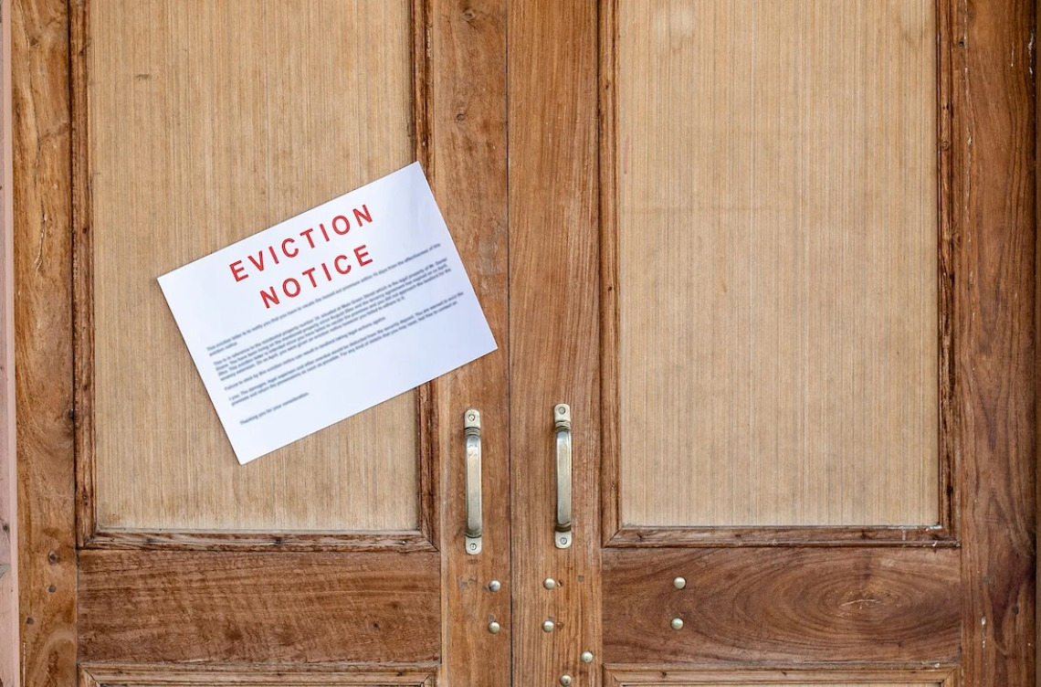 Eviction notice on wooden double doors