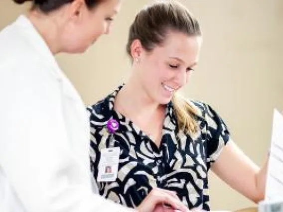 Nurses looking at a report
