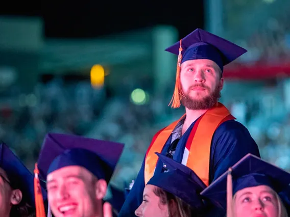 man in cap and gown