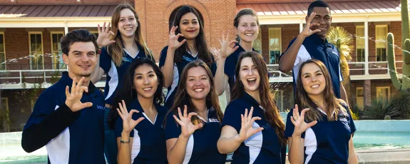 SBS student ambassadors posing in front of Old Main