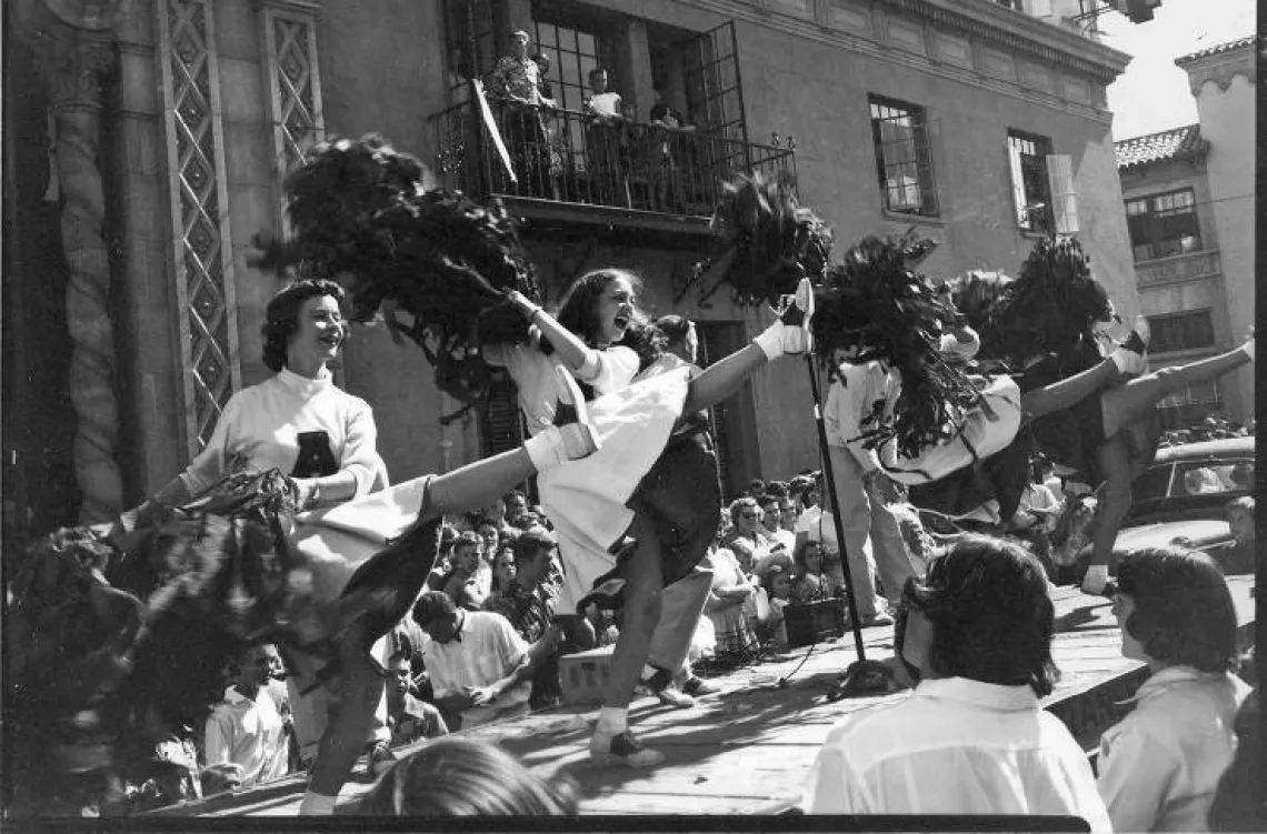 University of Arizona cheerleaders perform during a 1952 pep rally outside the Pioneer building in downtown Tucson.