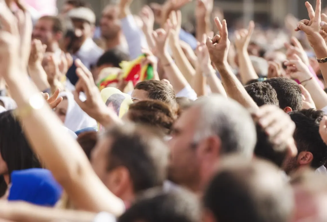 people holding up arms