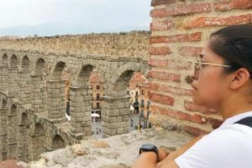 Student looking into ruins.