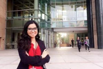 Student standing outside a building