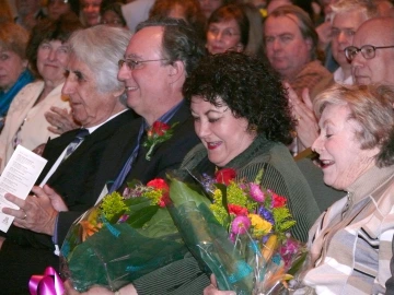 Vivi presented with flowers at the Sabbagh Lecture. To her left is the late Selma Paul Marks. To her right is Professor Juan R.I. Cole, who spoke in 2006 and 2012.