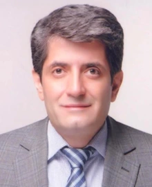 Man in gray suit and blue striped tie