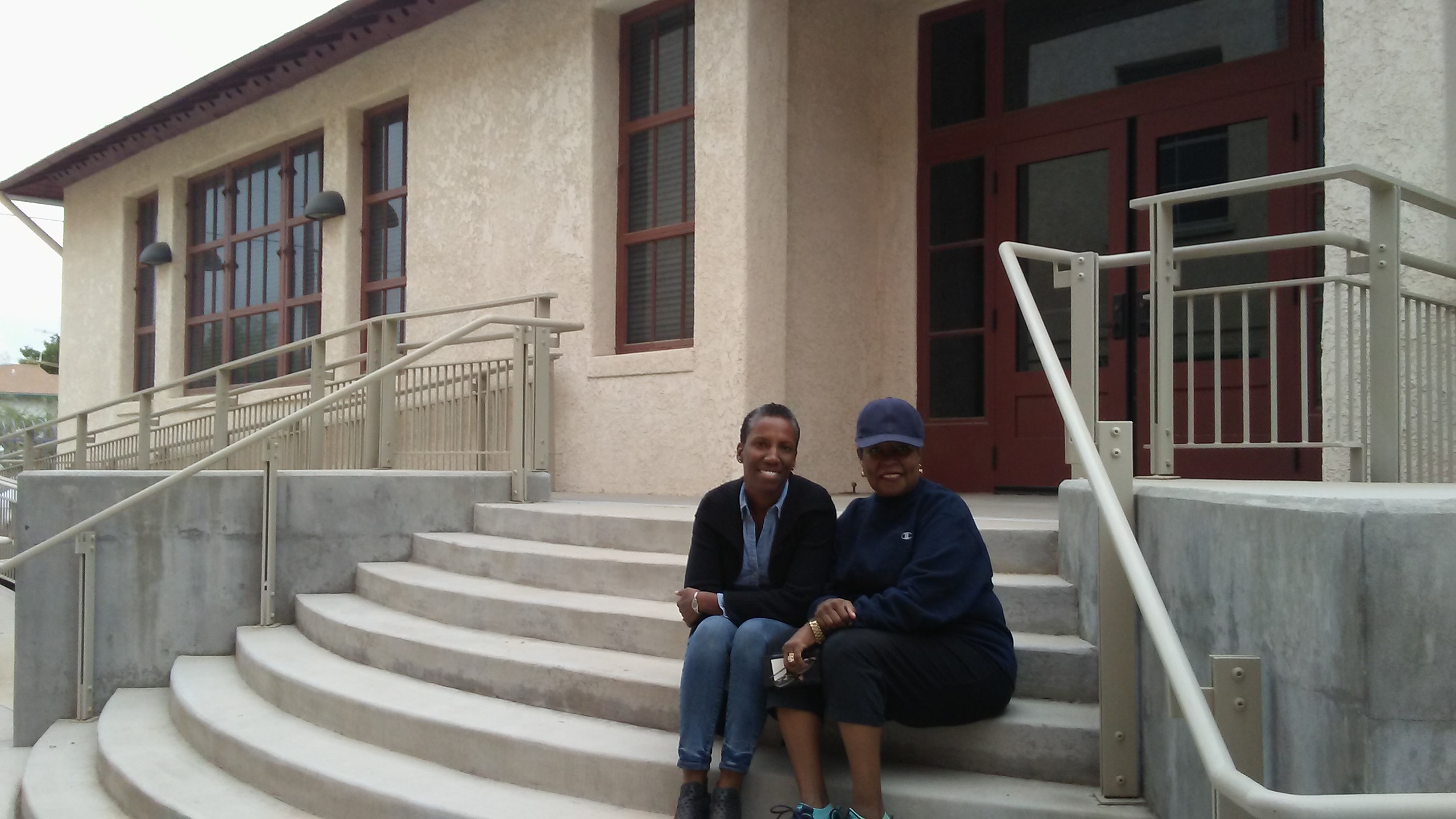 SBS Community Impact Fellow Debi Chess Mabie and Chyrl Lander on the steps of the Dunbar Pavilion
