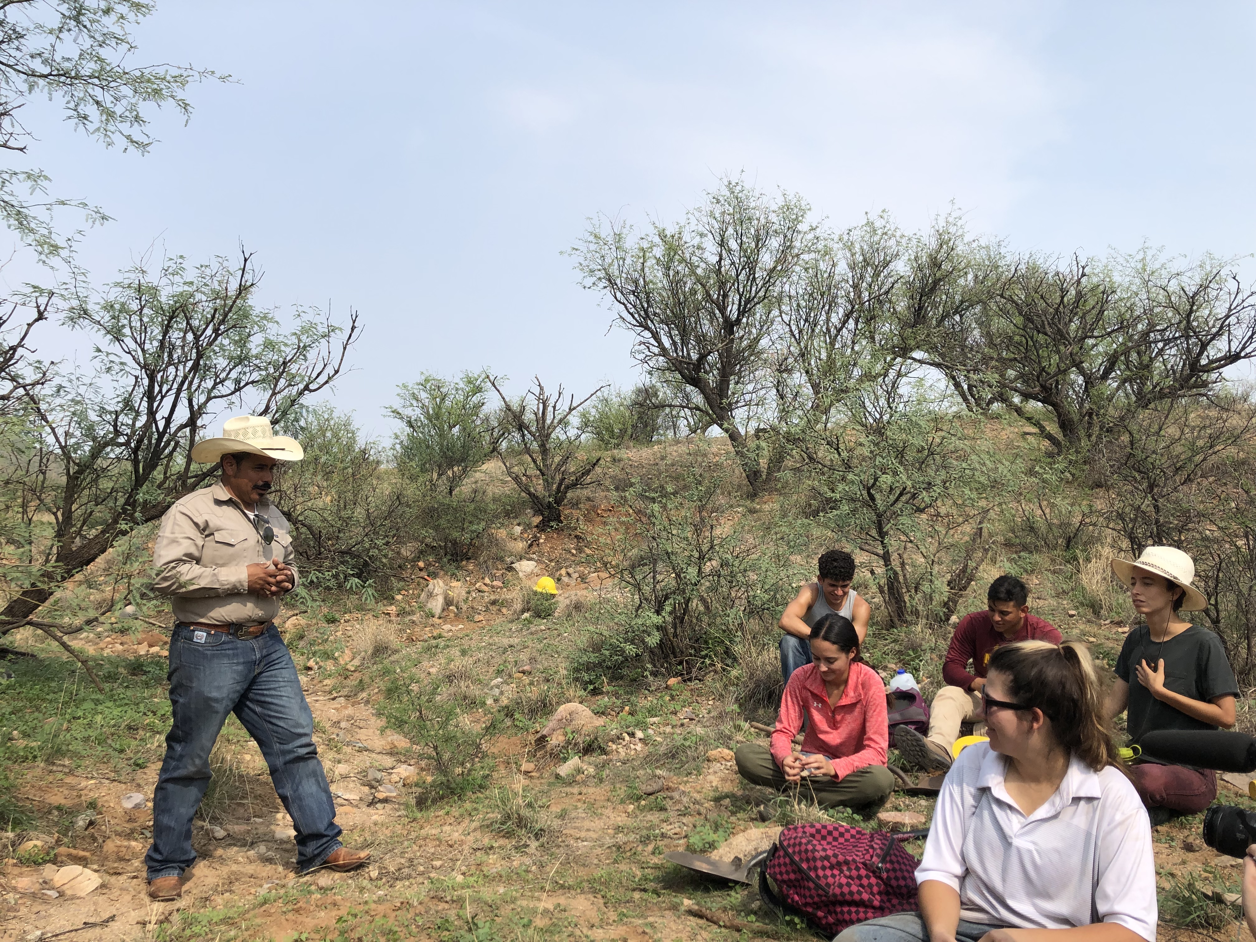 2021 SFSW Fellows learn from a rancher about erosion prevention and sustainable agriculture. 