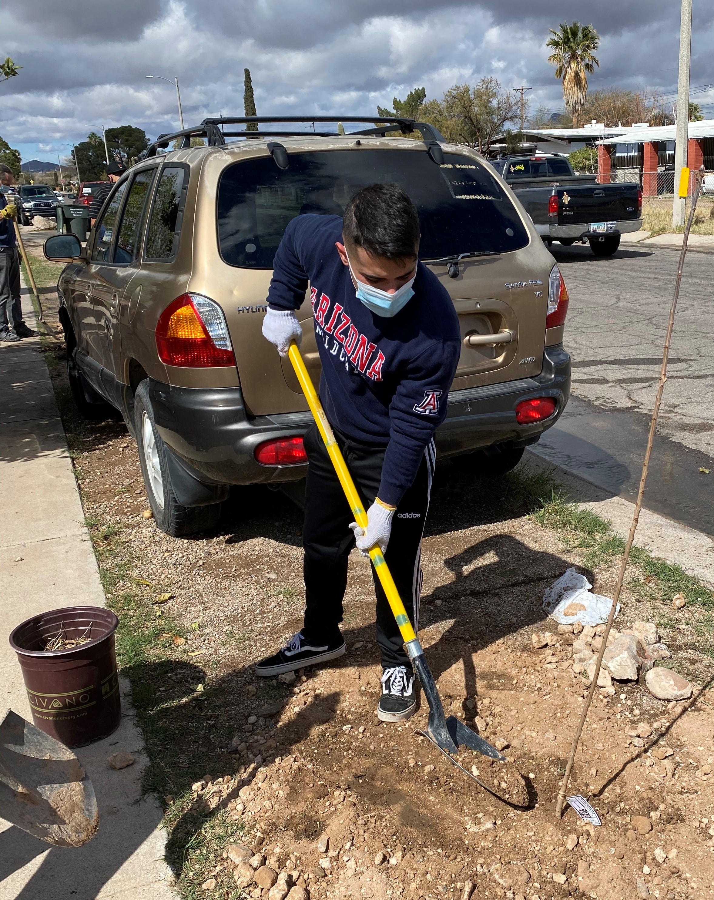 Patrick Robles planted trees in South Tucson as part of the Trees for Tucson project. 