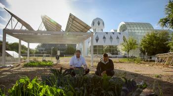 Researchers work at the experimental garden at Biosphere 2