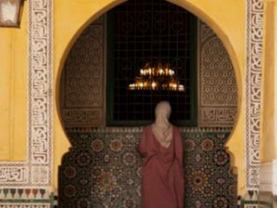 Woman in front of mosque