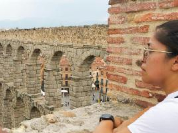 Student looking into ruins.