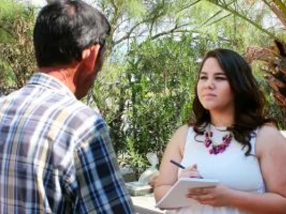 Student reporter interviewing someone.