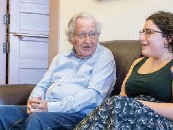 Noam Chomsky discussing with a student.