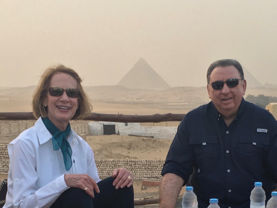 Nancy and Steve Lynn sitting in front of the pyramids