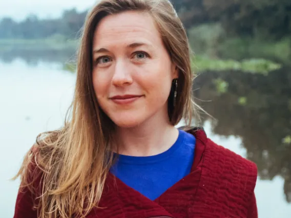 Beth Tellman standing in front of a body of water