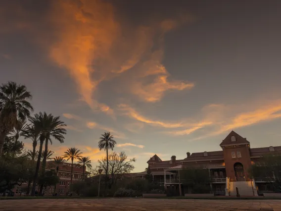 Old Main building at University of Arizona with clouds and sunset