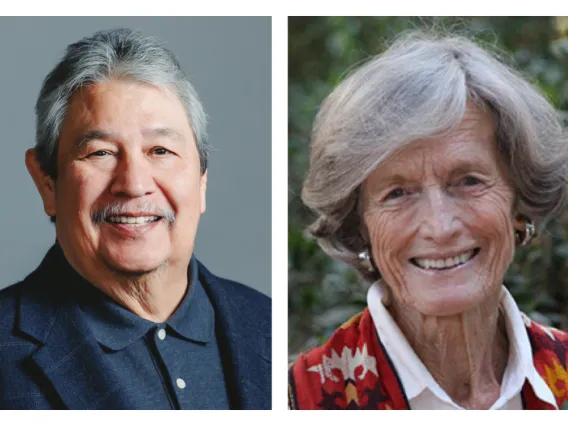 Man with gray hair and moustache on the left and silver haired woman with red jacket on the right