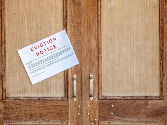 Eviction notice on wooden double doors