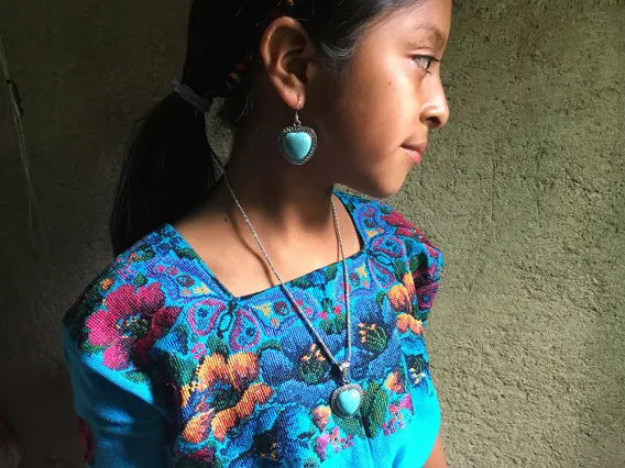 young Latina with aqua dress with flowers