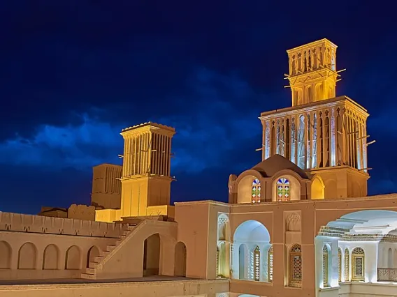 A nighttime photo of the Aghazadeh Mansion in Iran