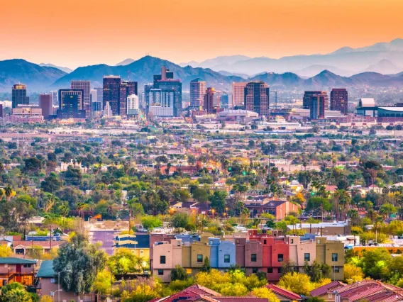 Colorful photo of Phoenix skyline with mountains in the background