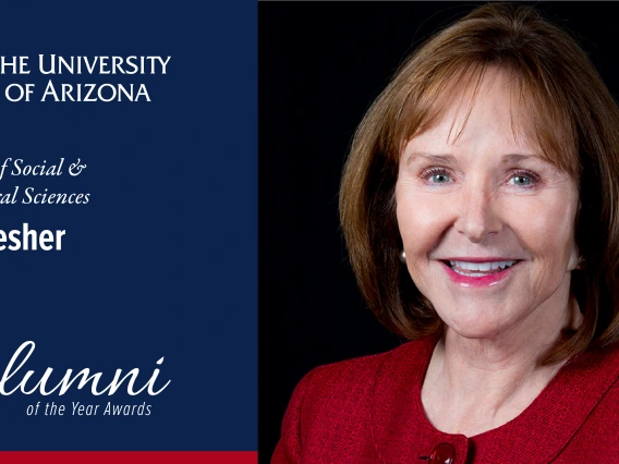 Photo of Jan Lesher on the right, wearing a red blouse. On the left is a blue background with the U of A logo and "Jan Lesher, Alumni of the Year" 