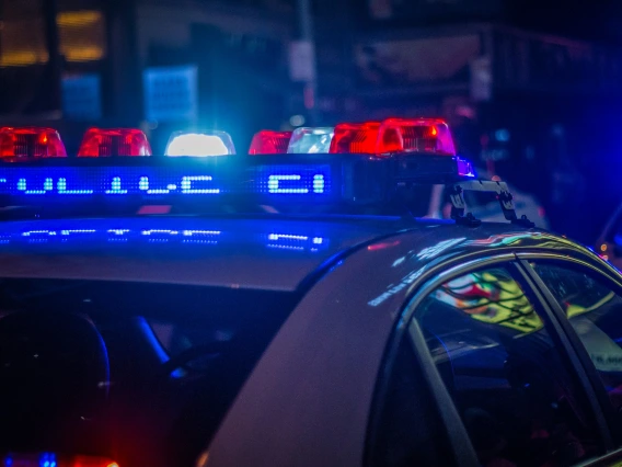 Police car with bright lights at night