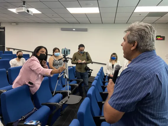 students interviewing man at a classroom