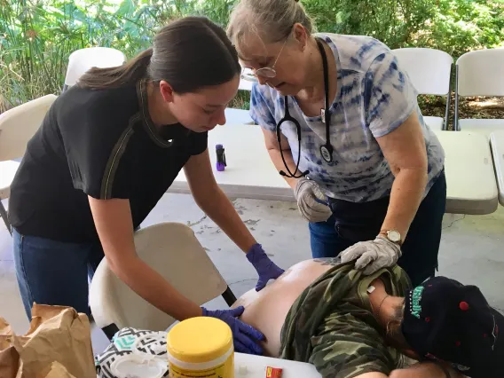 two women conducting a pulmonary assessment