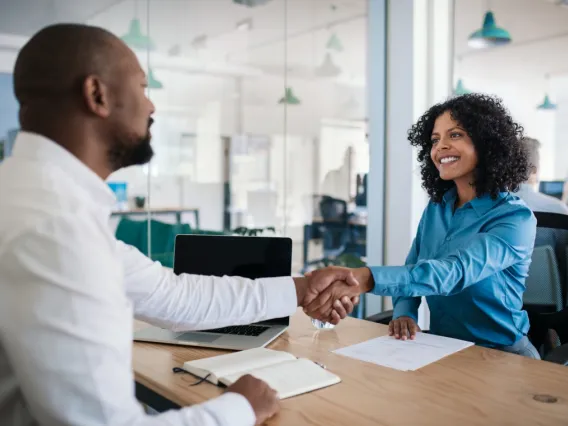 man and woman shaking hands