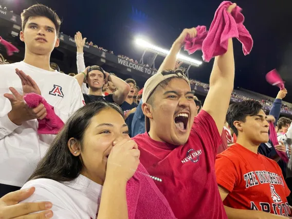 Fans celebrating at Wildcat game. Photo by Allison Burgess.