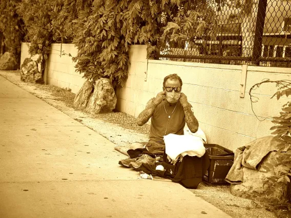 homeless man with mask