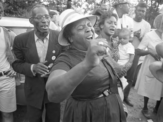 Fannie Lou Hamer singing to a group of people