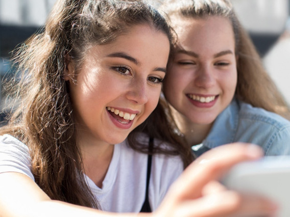 two teen girl taking a selfie