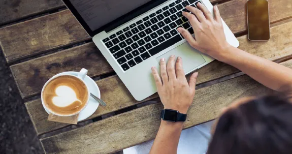 Person typing on laptop