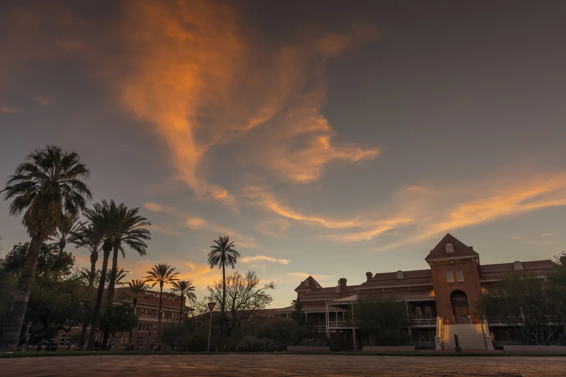 Old Main building at University of Arizona with clouds and sunset