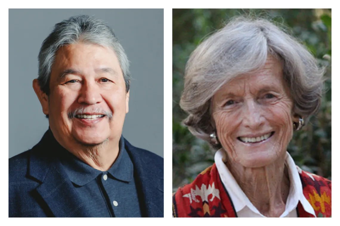 Man with gray hair and moustache on the left and silver haired woman with red jacket on the right