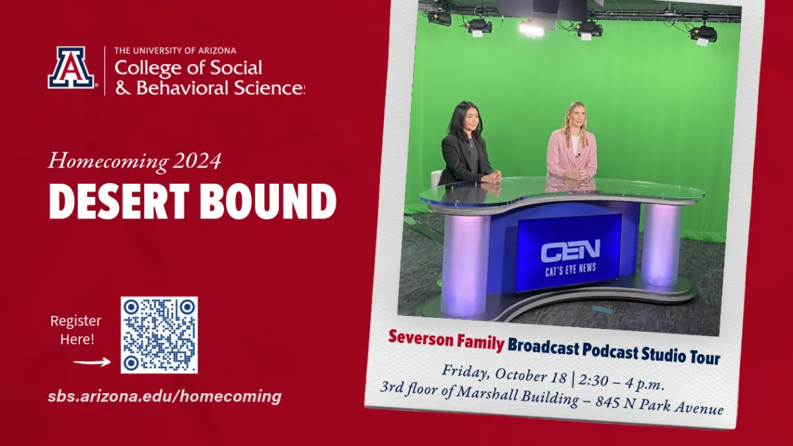 two young women sitting at a news desk with a green screen behind them.