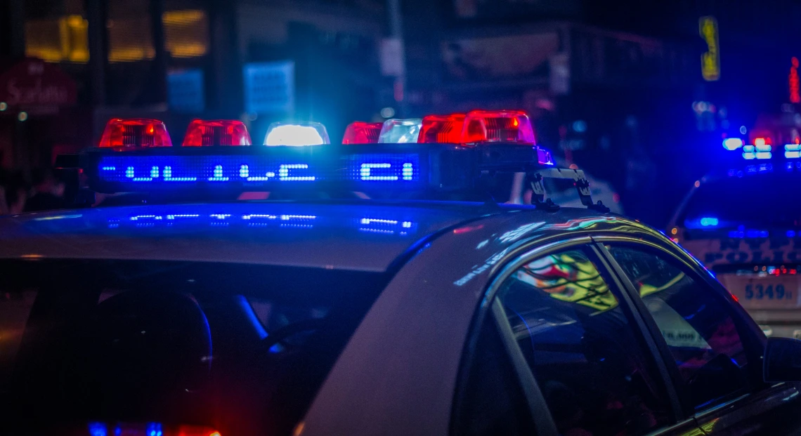 Police car with bright lights at night