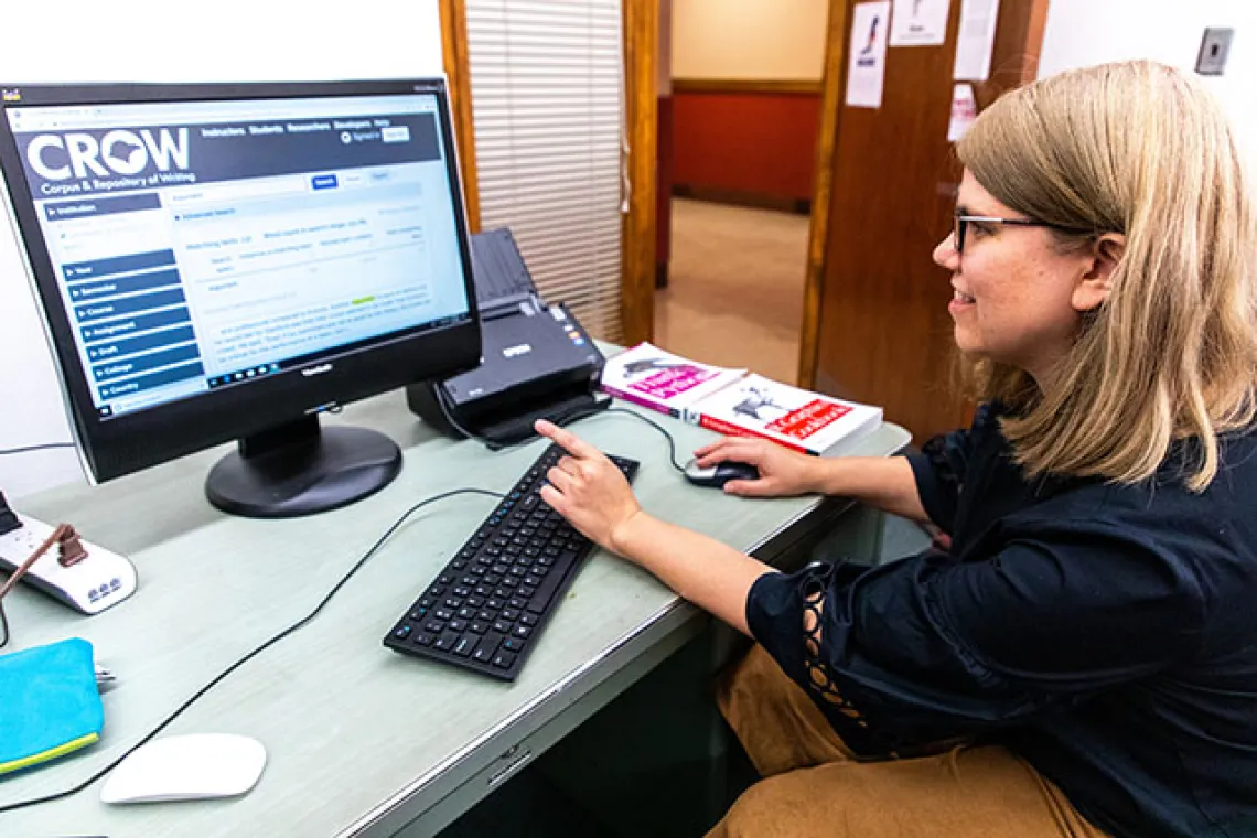 UArizona English Professor Shelley Staples at computer