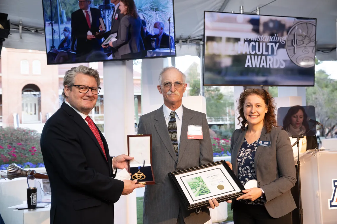 Vance Holliday with JP Jones III, dean of the College of SBS, and Carmala Garzione, dean of the College of Science