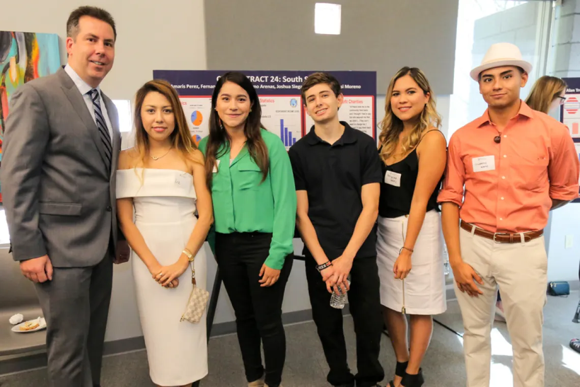 Brian Mayer (left) with students in the Poverty Workshop.