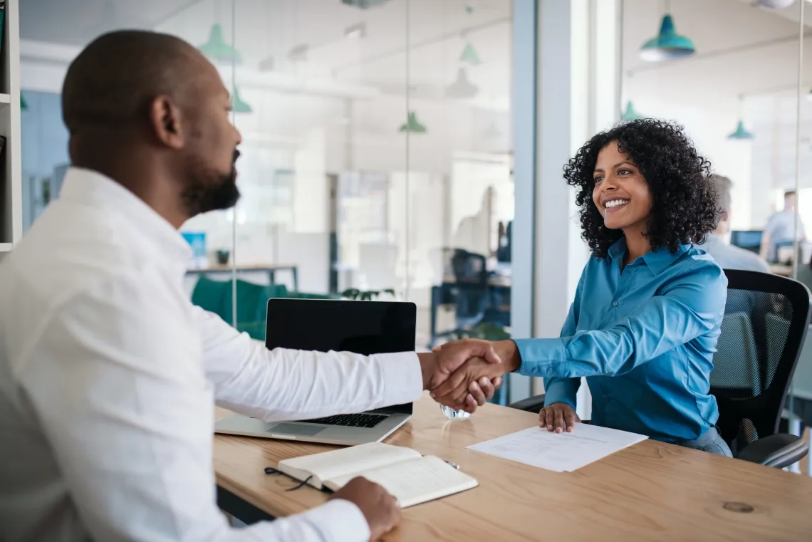 man and woman shaking hands