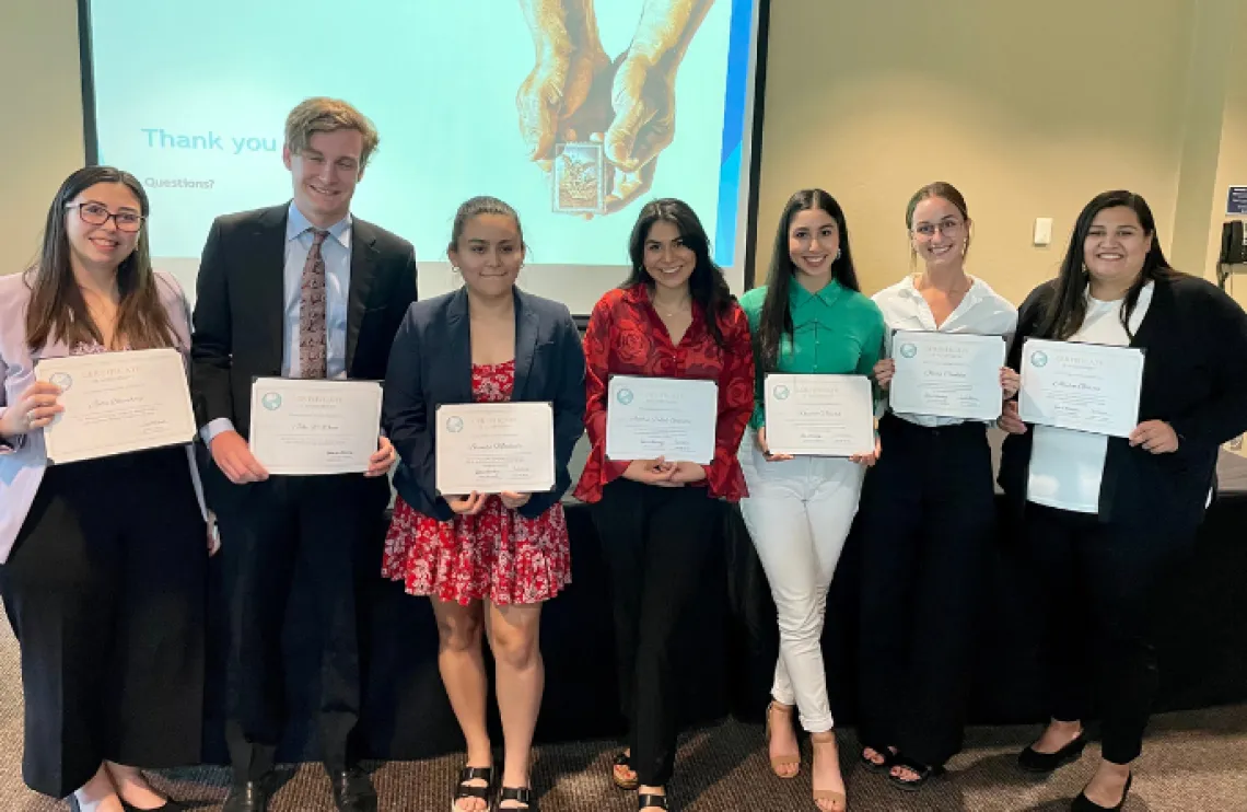 LASSO committee, seven college students holding certificates