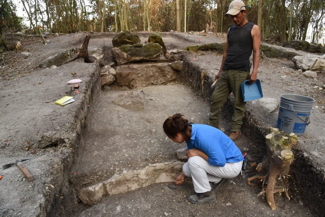 Melina García (front) excavates the central part of Aguada Fenix, the largest and oldest Maya monument ever uncovered.