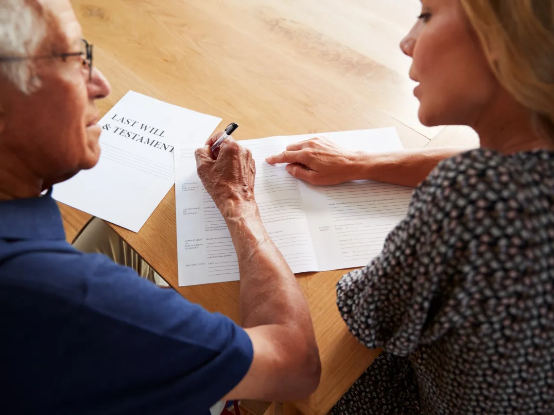 a man and woman going over a will 