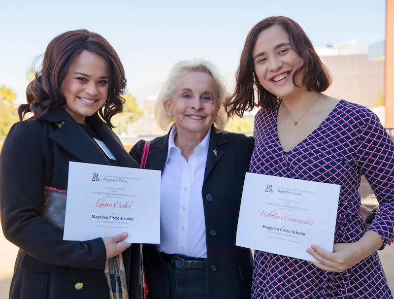 Magellan Circle Scholars Lauren Easter and Victoria Ramassini and their patron